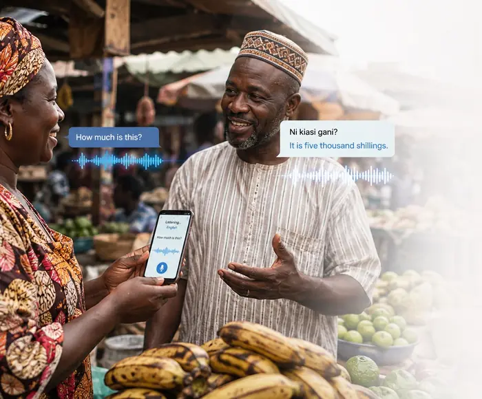 A trader holds up a phone running SanKam while a stallholder answers in Kiswahili
